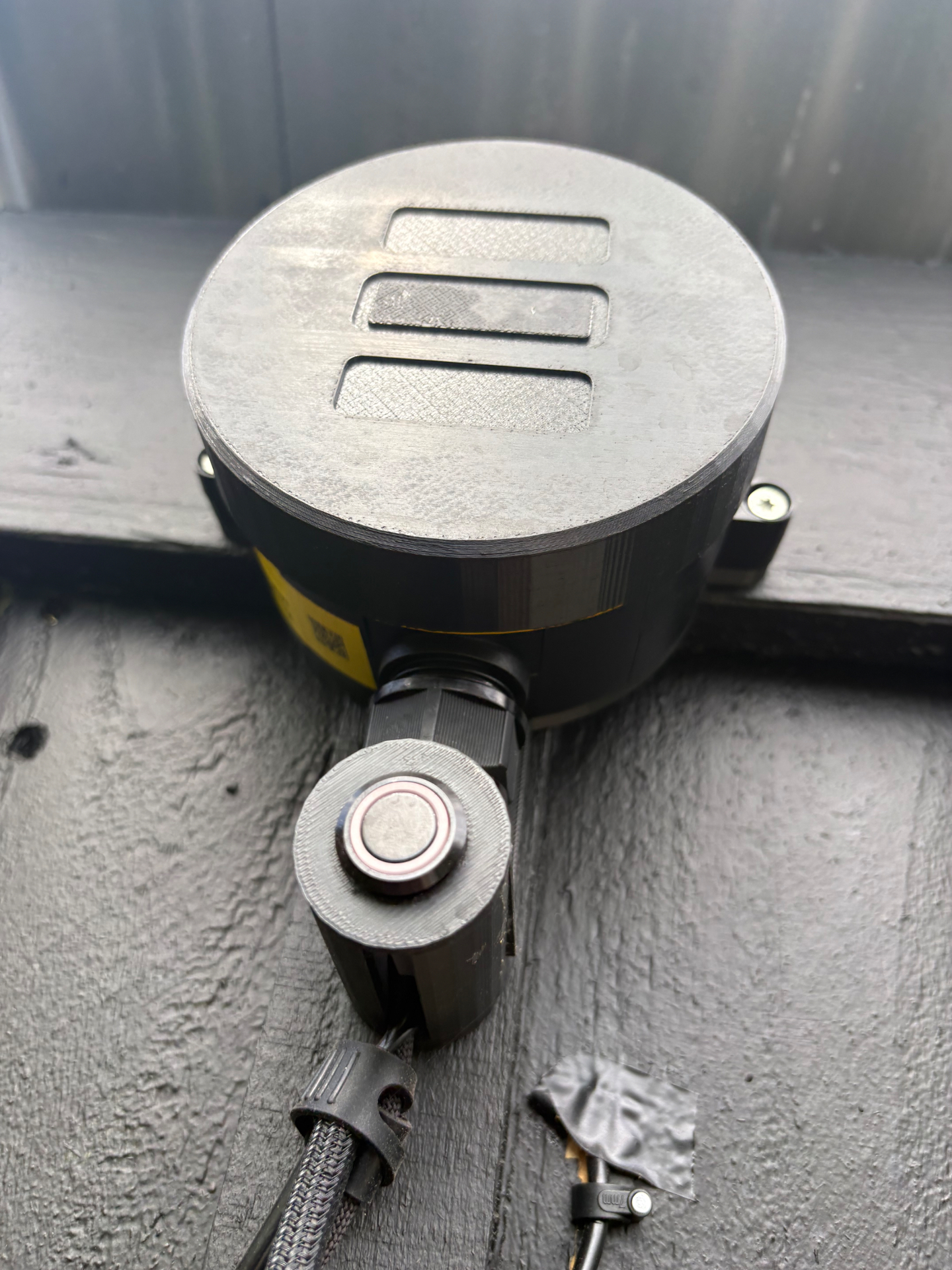SenseStack Base Device: circular sealed unit with brushed alloy face plate and cable gland