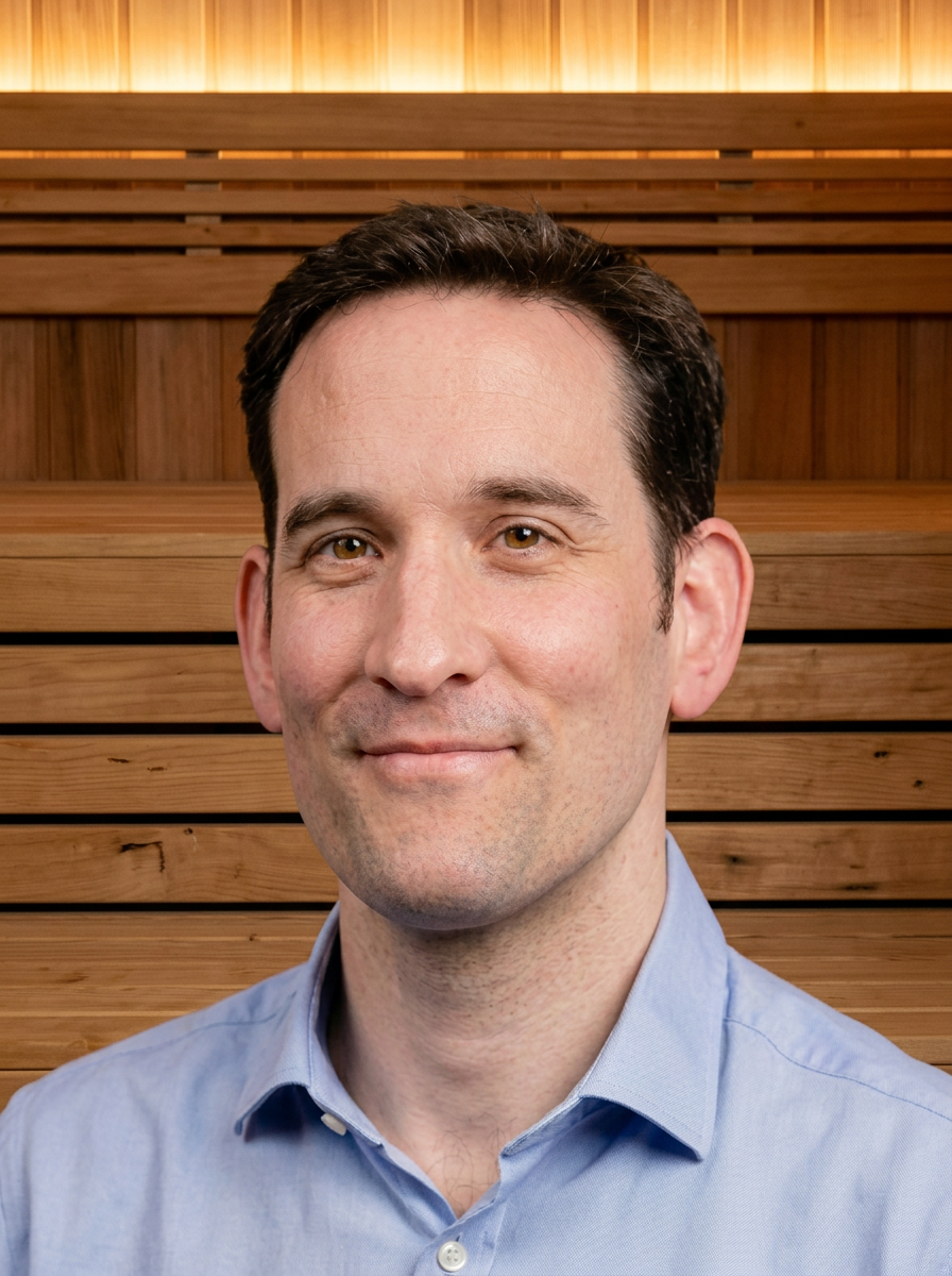 Mike O'Callaghan, founder of SenseStack, photographed inside a wood-clad sauna